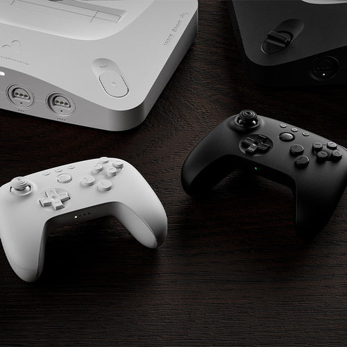 8BitDo 64 Bluetooth – retro-controller, hvid – To farvevarianter som illustration, én hvid medfølger