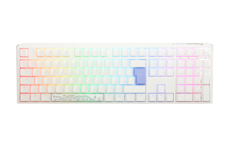 A Ducky mechanical keyboard with multicolored backlit keys, ranging from red through the spectrum to purple, featuring double-shot PBT keycaps and a custom white casing with a floral design on the bottom right.