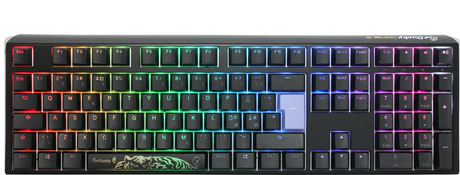 A colorful backlit mechanical gaming keyboard with vibrant rainbow LED lights, featuring a Ducky One 3 - Classic Black / White Nordic - Fullsize - Cherry Red logo on the space bar and a dark gray frame. The keys are laid out in a typical QWERTY configuration.