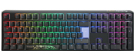 A colorful backlit Ducky One 3 - Classic Black Nordic - Fullsize - Cherry Silent Red mechanical gaming keyboard with keys illuminated in a rainbow gradient, featuring a black body and a visible Ducky logo at the bottom center.