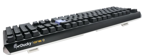 A Ducky One 3 - Classic Black / White Nordic - Fullsize - Cherry Silent Red mechanical keyboard with black keys and a white backlight, slightly raised angle, featuring a sleek, modern design on a transparent background.